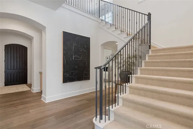 a view of entryway with wooden floor and door