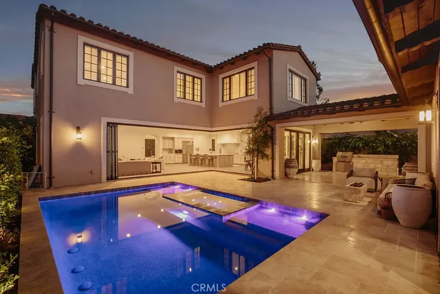 a view of swimming pool with seating area and furniture
