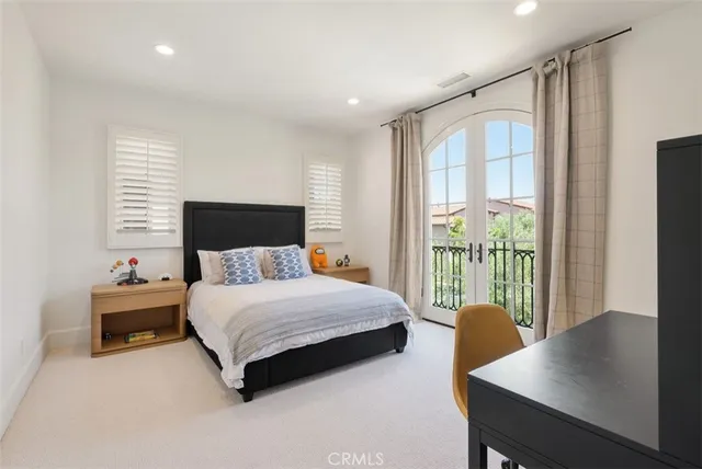 a bedroom with a bed and a table