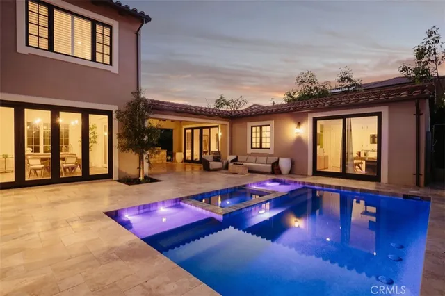 a living room with furniture pool table and a large window
