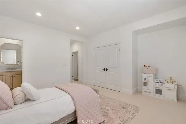 a bedroom with a bed and a couch