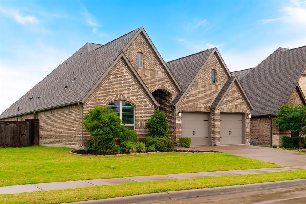 1501 Calcot Lane Forney, TX 75126 - Photo 2 of 34 Brick exterior with multiple gables and a two-car garage