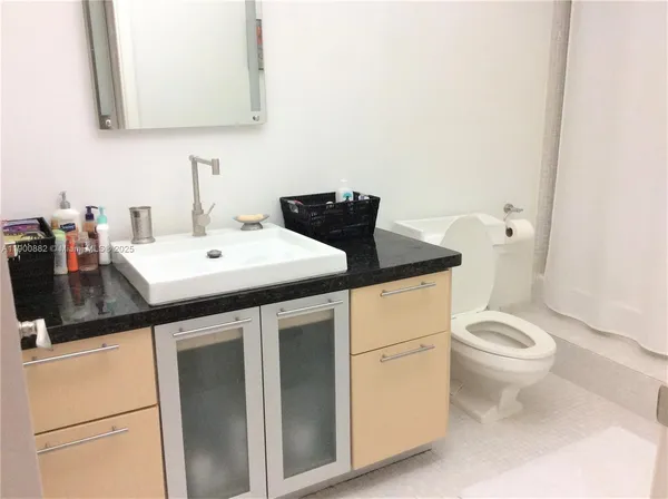 a close view of a sink and washer and dryer