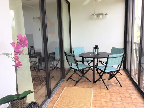 a view of a room with furniture and a potted plant