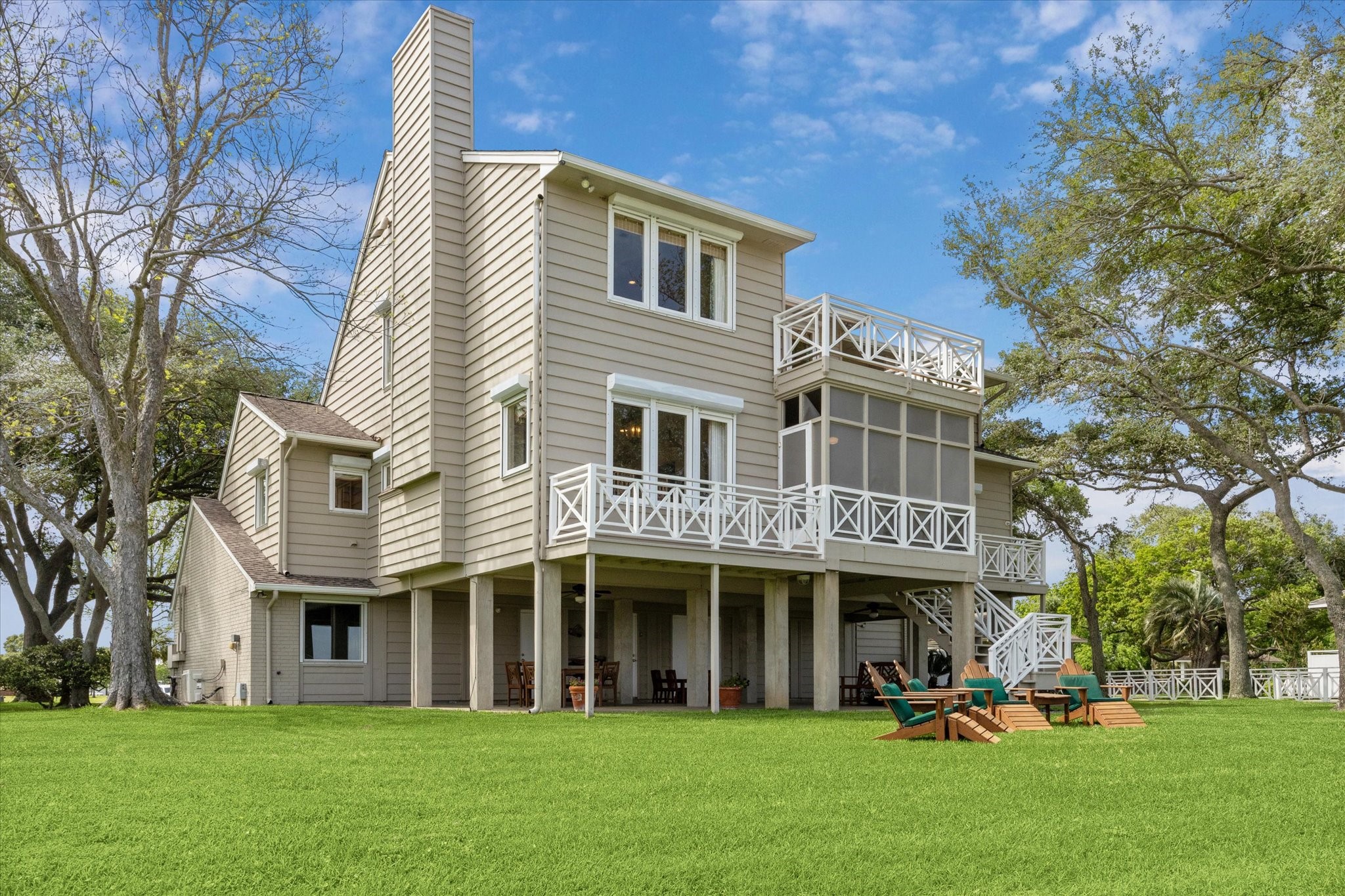 102 South R Street La Porte, TX 77571 - Photo 16 of 43 a front view of a house with a garden and trees