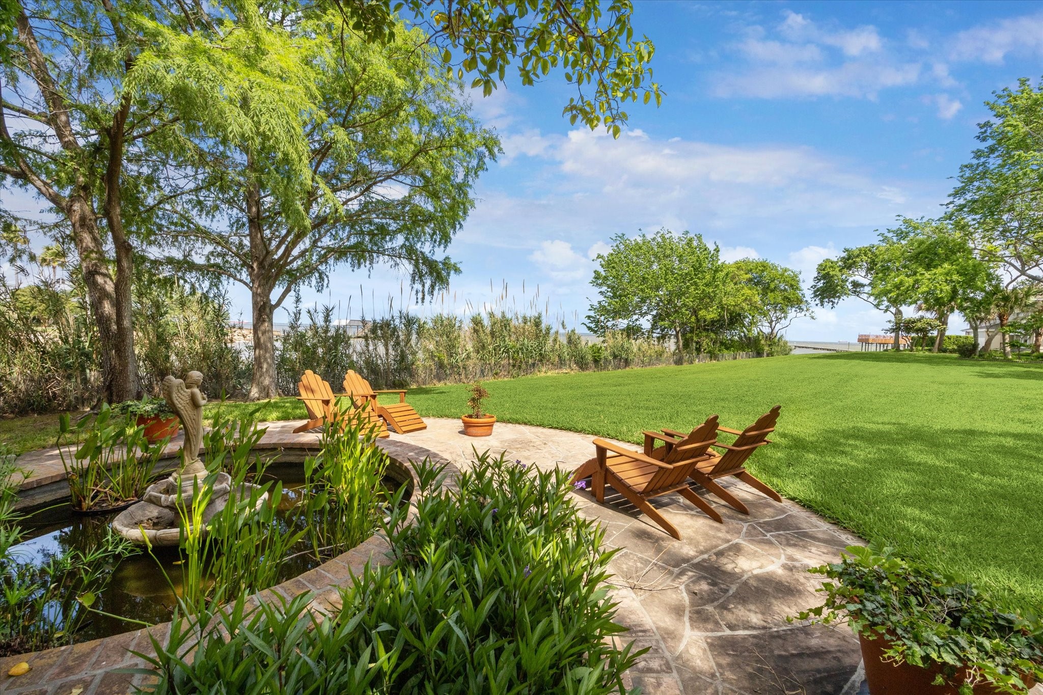 102 South R Street La Porte, TX 77571 - Photo 42 of 43 a view of a lake with a yard