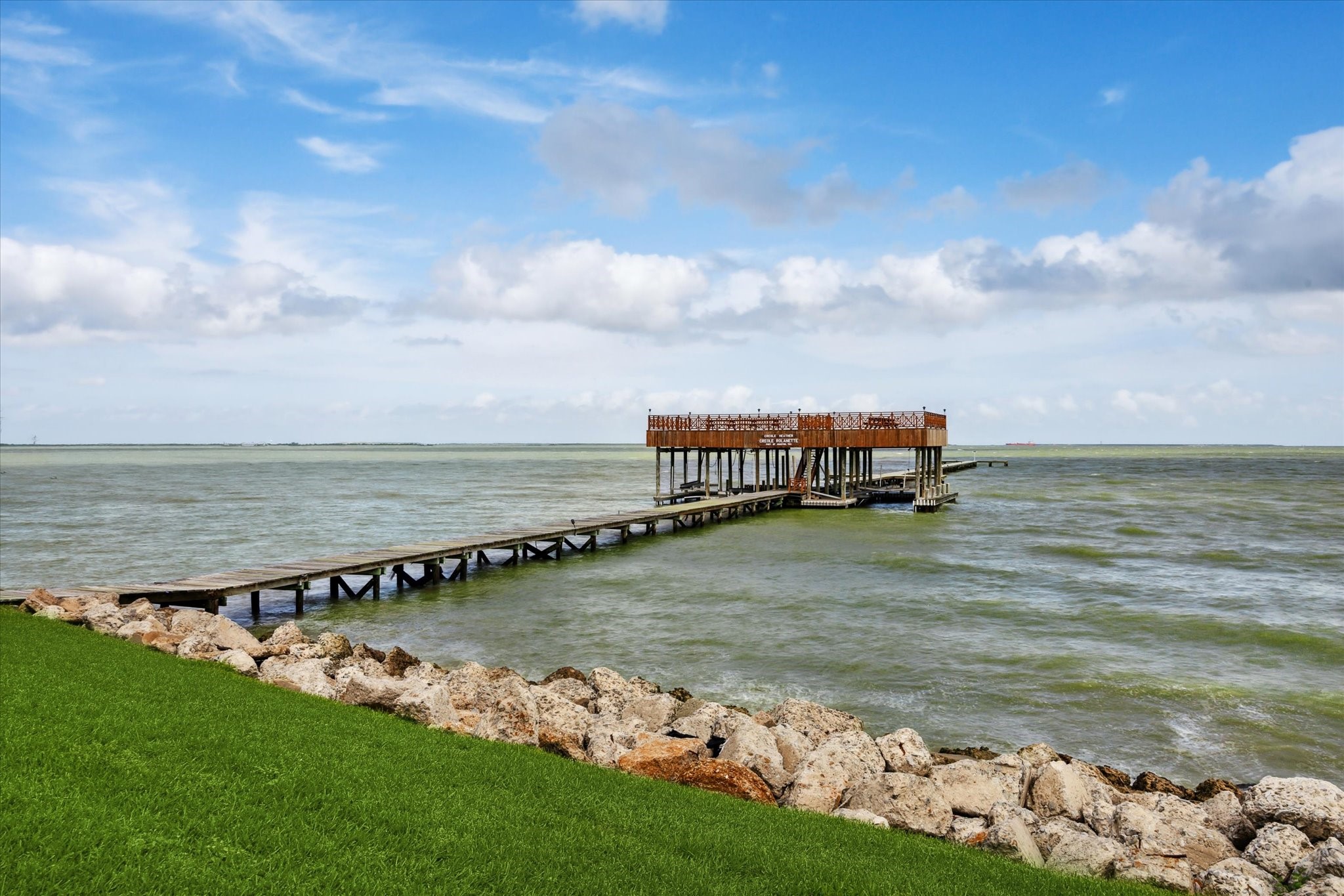 102 South R Street La Porte, TX 77571 - Photo 9 of 43 a view of a lake with a big yard