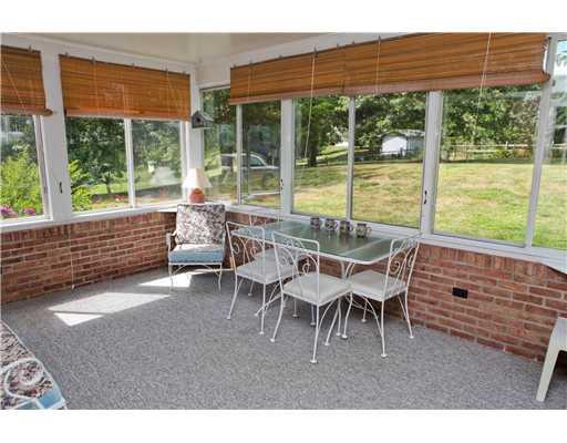 118 Ridgeview Drive Venetia, PA 15367 - Photo 7 of 15 Sunroom. How nice! Sunroom with half brick walls is a great spot to enjoy the picturesque rear grounds and gardens.
