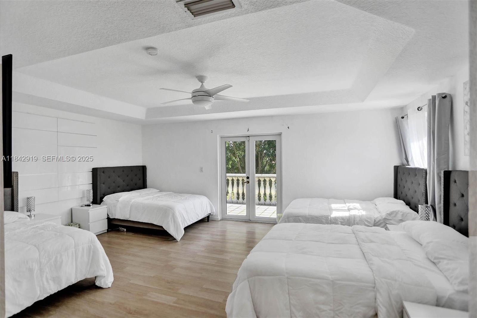 721 Ranch Road Weston, FL 33326 - Photo 26 of 38 a bedroom with bed and a large window