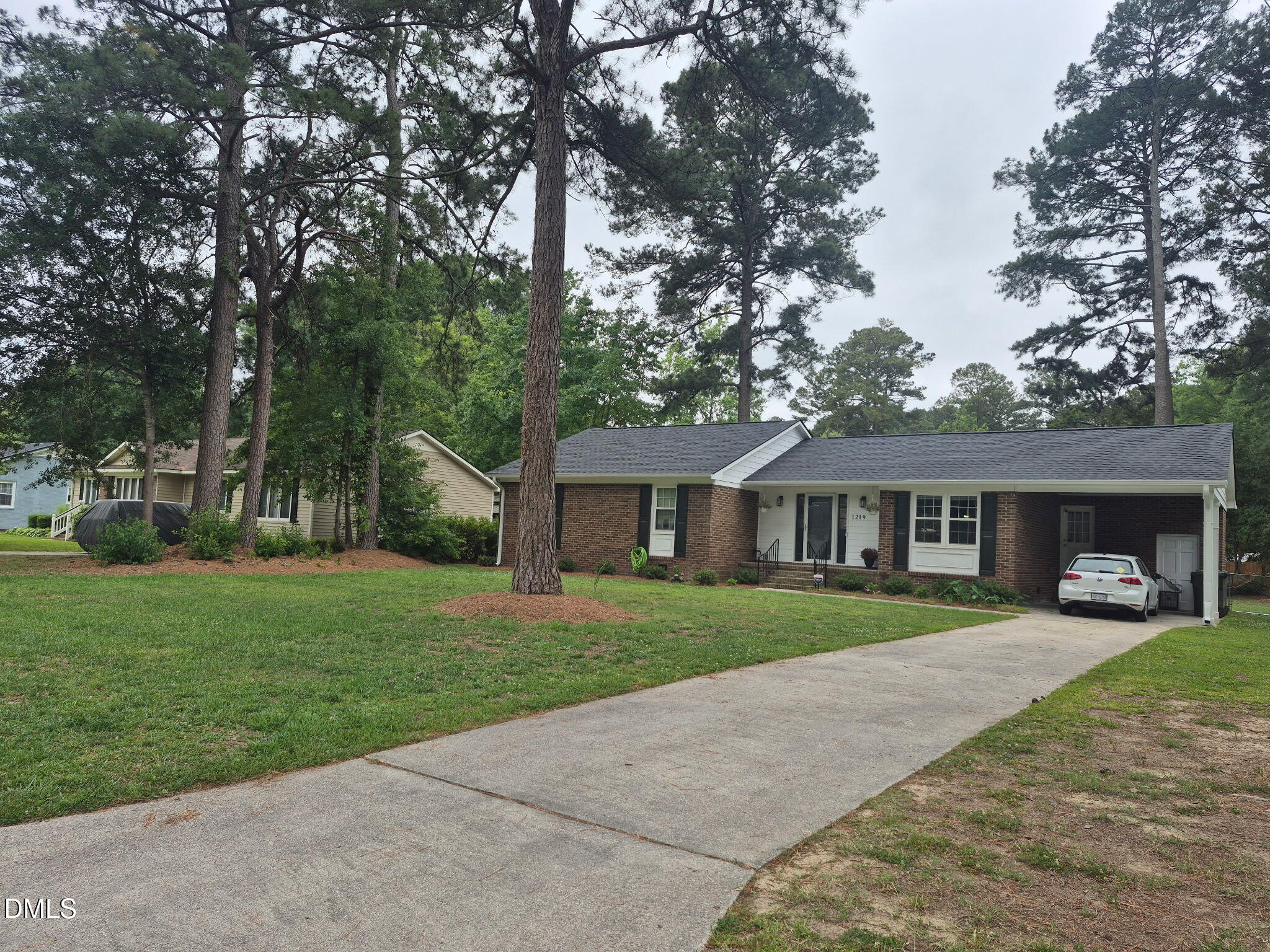 1219 Queen Anne Road Northwest Wilson, NC 27896 - Photo 8 of 26 front view of a house with a yard