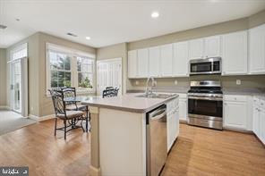 337 Main Street Gaithersburg, MD 20878 - Photo 7 of 35 a kitchen with a sink cabinets and window