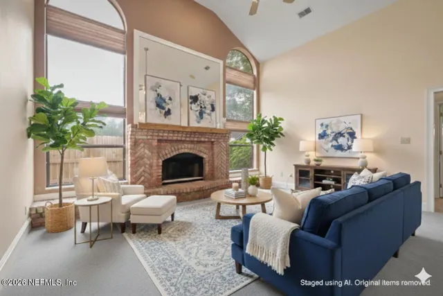a living room with furniture and a fireplace