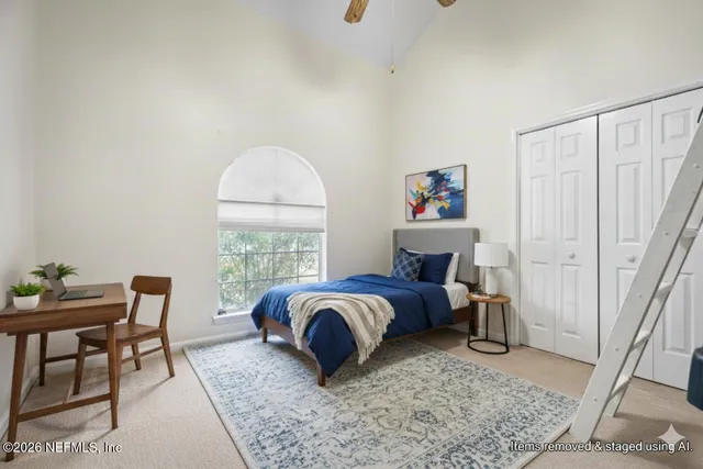 a bed room with furniture and a window