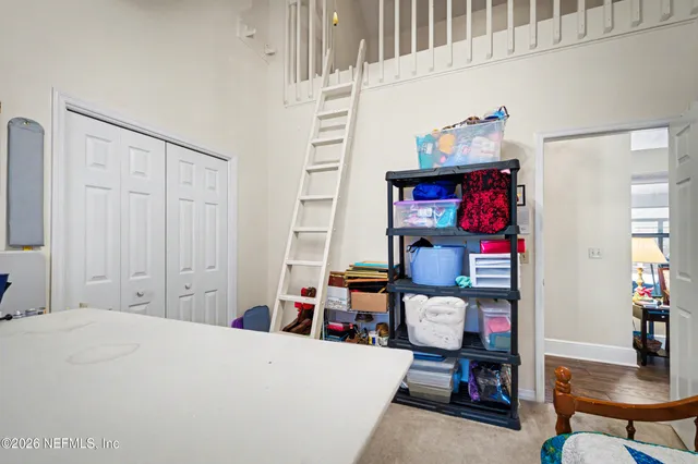 a bedroom with a bed and furniture