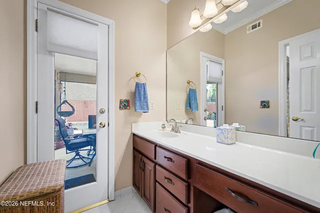 a bathroom with a sink a vanity and a mirror