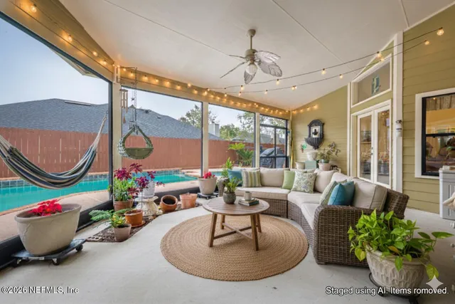 a living room with furniture and a large window