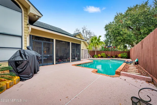 a view of a house with backyard and porch