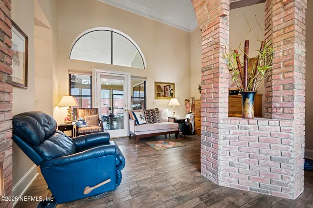 a living room with fireplace furniture and a flat screen tv