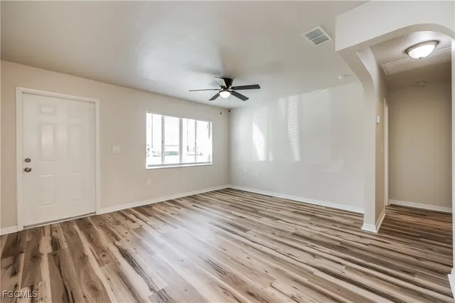 a view of an empty room with a window