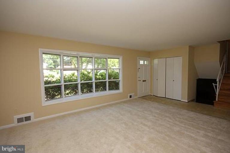 12707 Barbara Road Silver Spring, MD 20906 - Photo 2 of 21 an empty room with windows