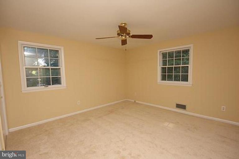 12707 Barbara Road Silver Spring, MD 20906 - Photo 11 of 21 an empty room with windows