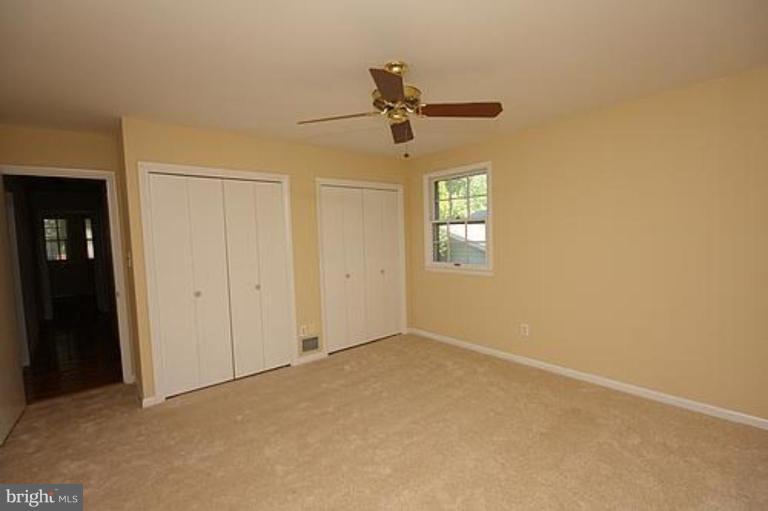 12707 Barbara Road Silver Spring, MD 20906 - Photo 12 of 21 an empty room with windows and fan