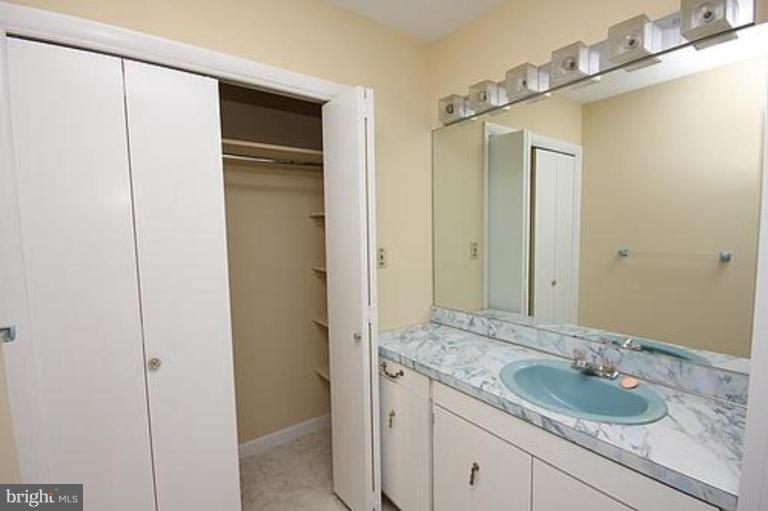 12707 Barbara Road Silver Spring, MD 20906 - Photo 13 of 21 a bathroom with a granite countertop sink and a mirror