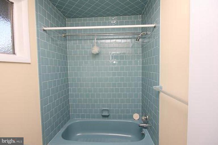 12707 Barbara Road Silver Spring, MD 20906 - Photo 14 of 21 a bathroom with a shower and a bathtub