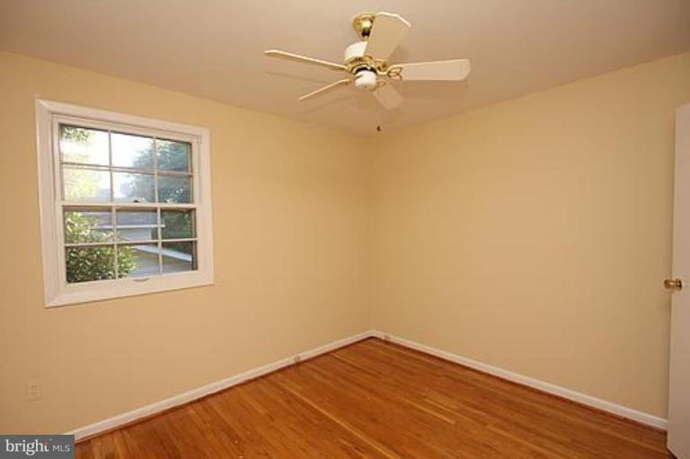 12707 Barbara Road Silver Spring, MD 20906 - Photo 16 of 21 an empty room with a window and a fan