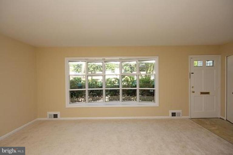 12707 Barbara Road Silver Spring, MD 20906 - Photo 3 of 21 an empty room with window
