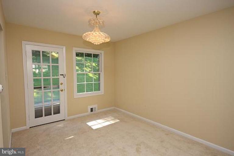12707 Barbara Road Silver Spring, MD 20906 - Photo 4 of 21 an empty room with a window