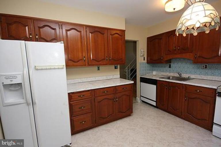 12707 Barbara Road Silver Spring, MD 20906 - Photo 6 of 21 a kitchen with stainless steel appliances granite countertop a refrigerator a sink and dishwasher