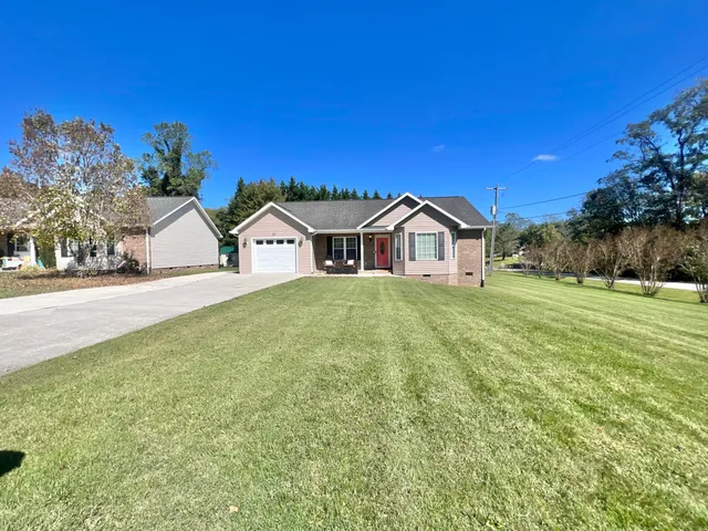 a view of a house with a yard