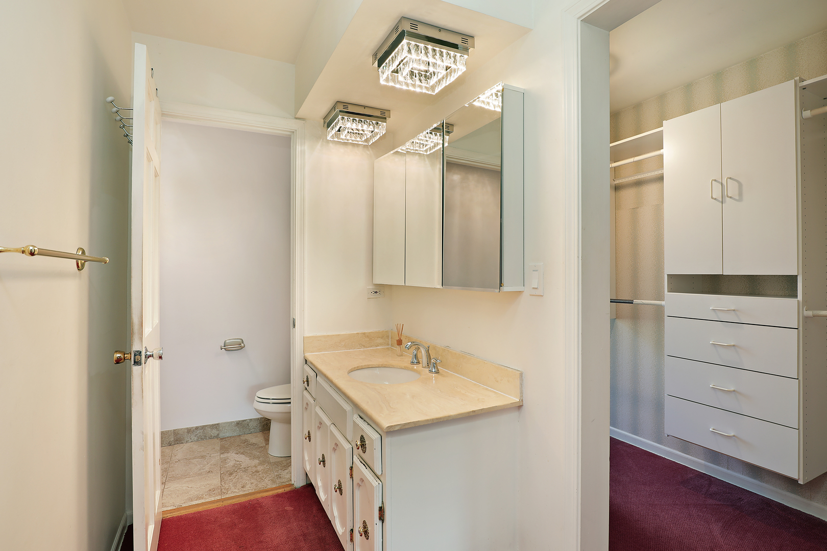 3815 Bordeaux Drive Northbrook, IL 60062 - Photo 22 of 56 a bathroom with a sink a toilet and a mirror