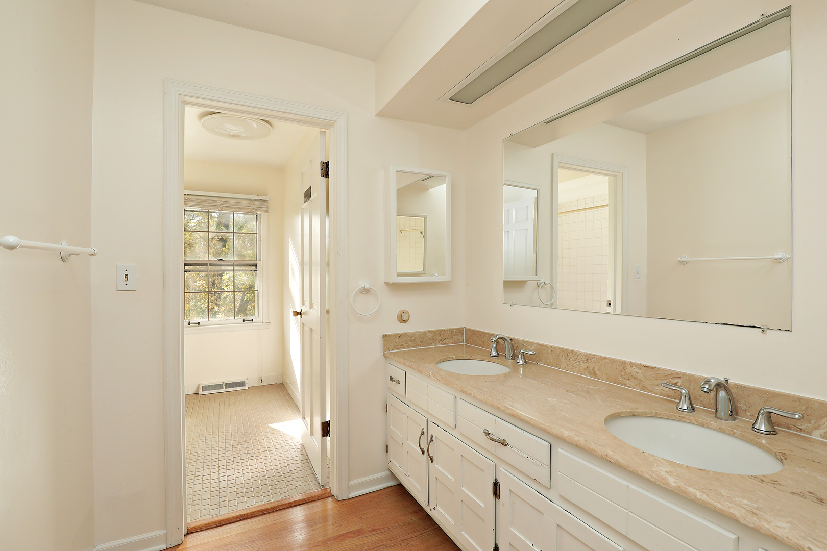 3815 Bordeaux Drive Northbrook, IL 60062 - Photo 27 of 56 a bathroom with double vanity sink and a mirror