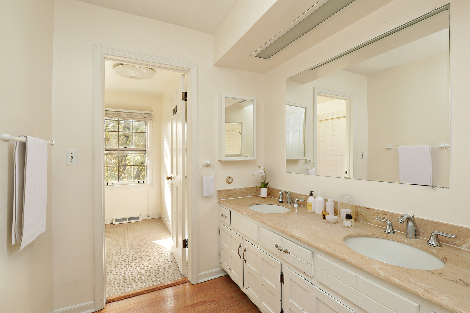 3815 Bordeaux Drive Northbrook, IL 60062 - Photo 43 of 56 a bathroom with double vanity sinks and a mirror