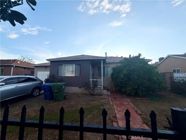 a front view of house with yard space and seating