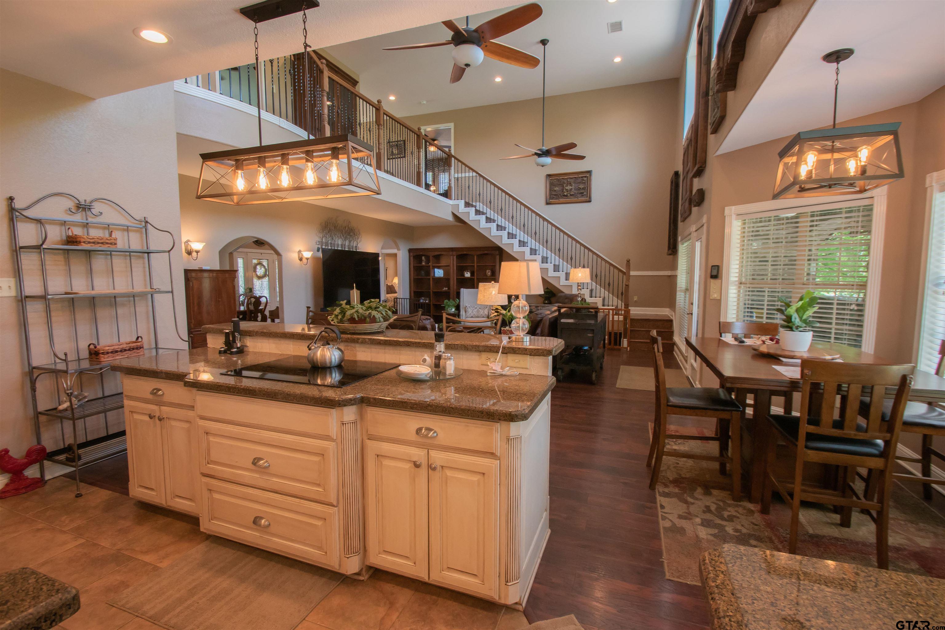 23120 Saddle Ridge Court Lindale, TX 75771 - Photo 8 of 34 a kitchen with stainless steel appliances granite countertop a stove and cabinets