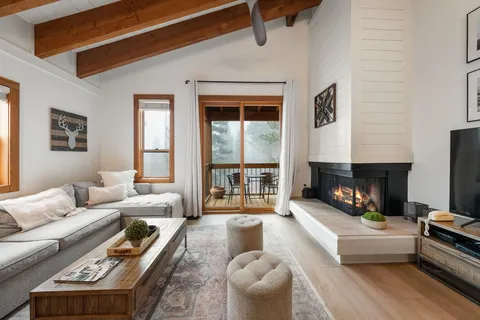 a living room with furniture fireplace and a fireplace