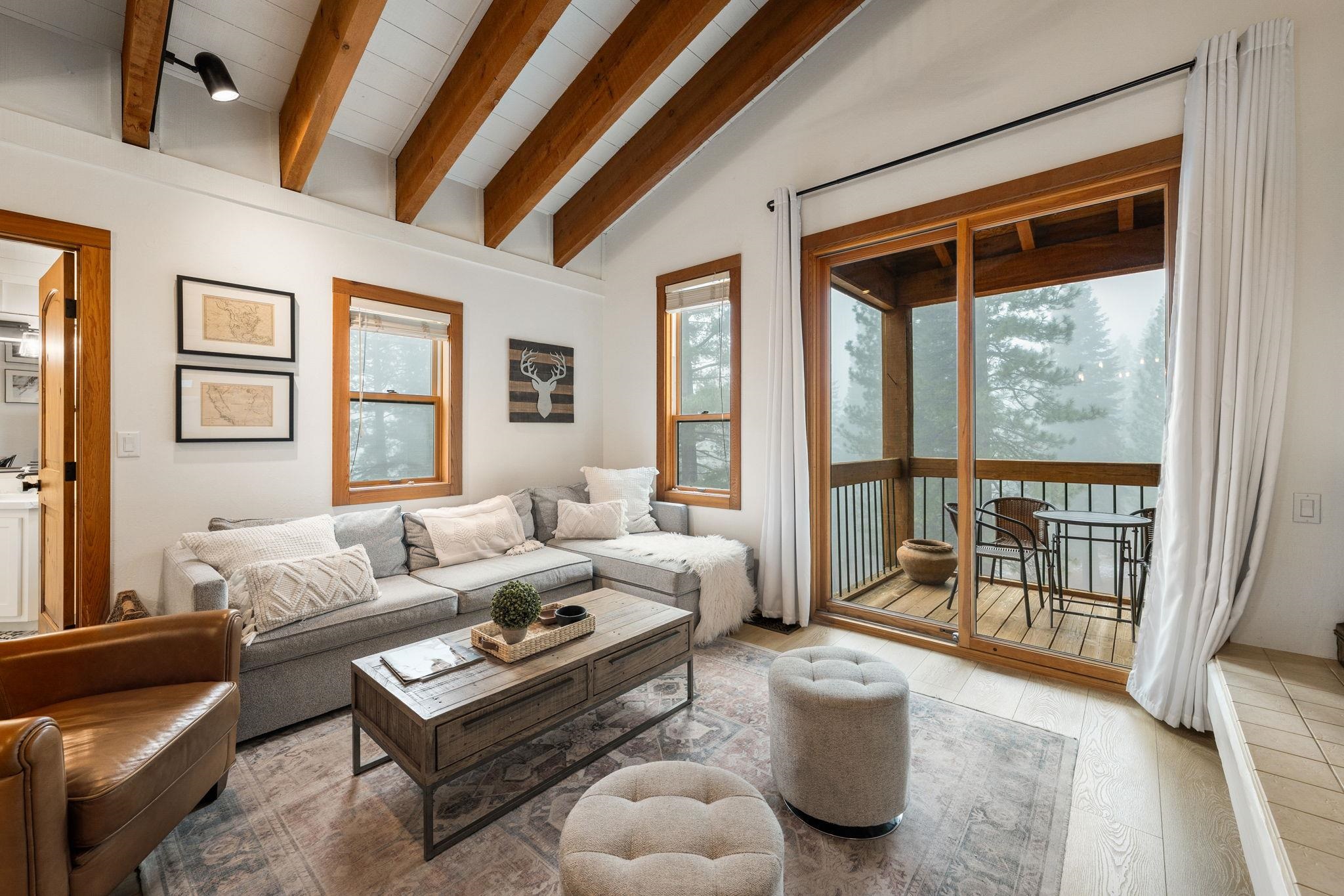 5085 Gold Bend Truckee, CA 96161 - Photo 12 of 22 a living room with furniture and a floor to ceiling window