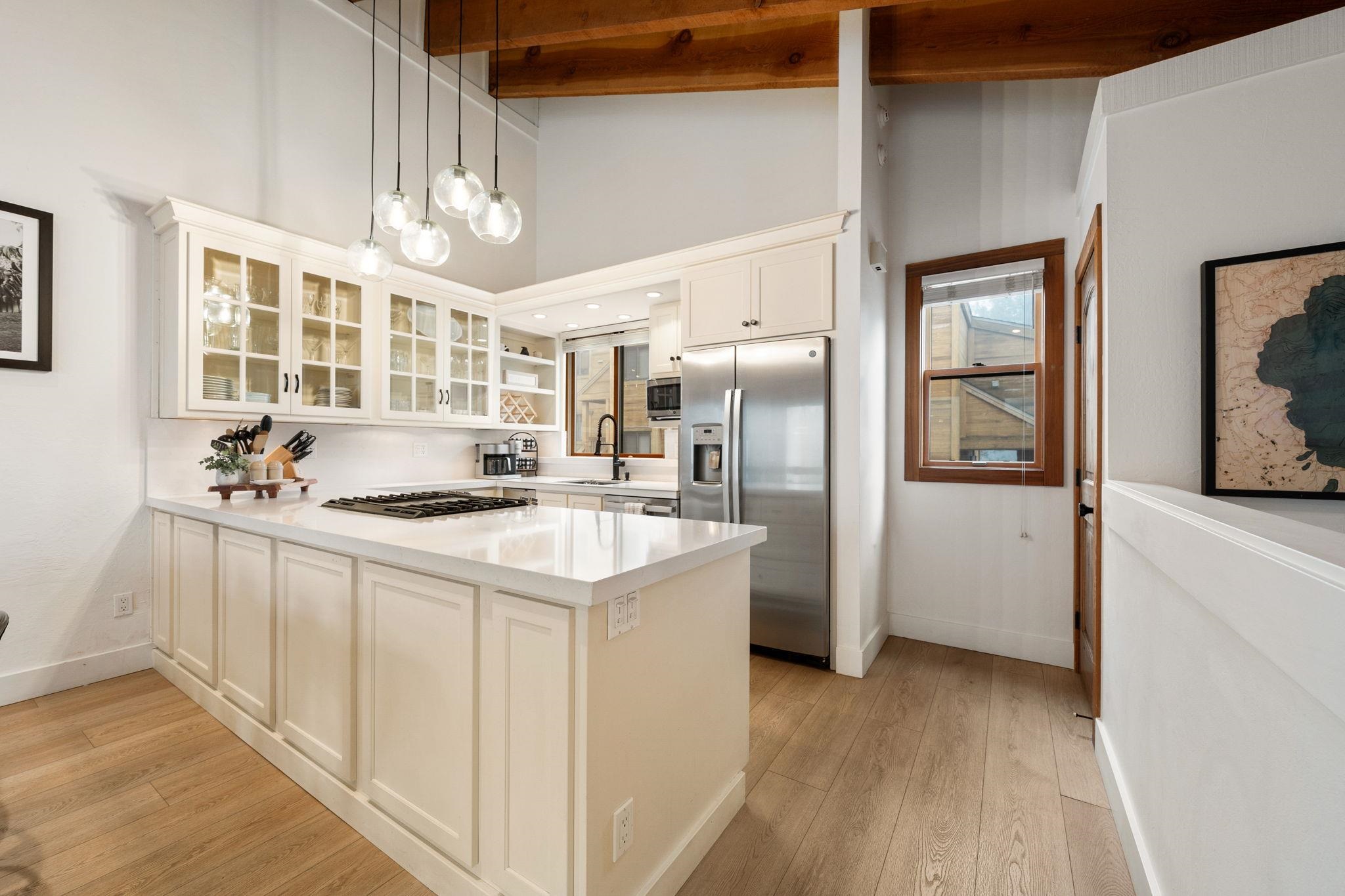 5085 Gold Bend Truckee, CA 96161 - Photo 14 of 22 a kitchen with stainless steel appliances granite countertop a sink stove and refrigerator