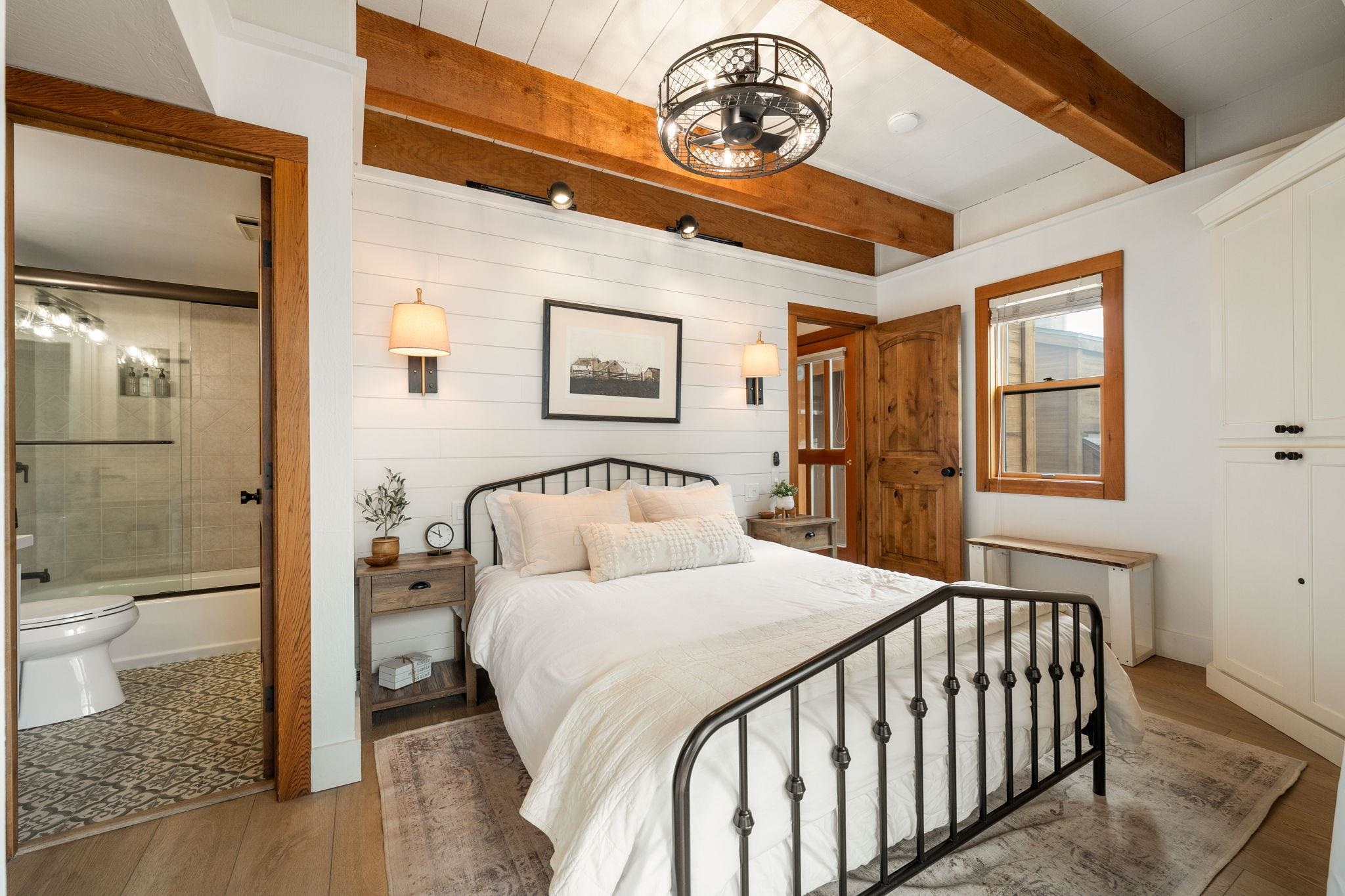 5085 Gold Bend Truckee, CA 96161 - Photo 5 of 22 a bedroom with a bed and a chandelier