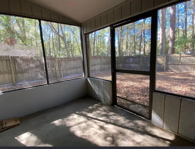 a view of an empty room and window