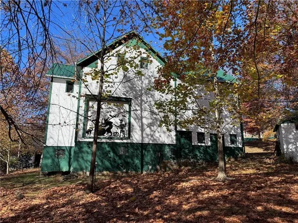 a view of a house with a tree