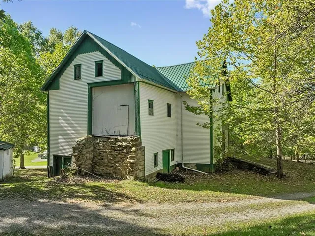 a view of a park with large trees