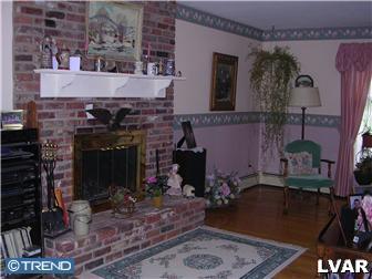 2310 Rickert Road Perkasie, PA 18944 - Photo 2 of 8 a room with fireplace and a table