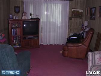 2310 Rickert Road Perkasie, PA 18944 - Photo 5 of 8 a living room with furniture and a flat screen tv