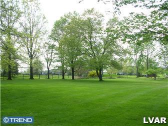 2310 Rickert Road Perkasie, PA 18944 - Photo 8 of 8 a view of a big yard with a trees