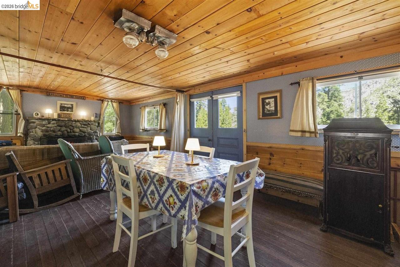 7 Riverside Tract Kyburz, CA 95720 - Photo 9 of 25 a view of a dining room with furniture window and wooden floor
