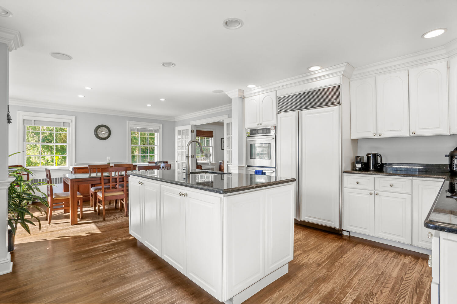 110 Gower Road New Canaan, CT 06840 - Photo 11 of 39 a kitchen with white cabinets and sink